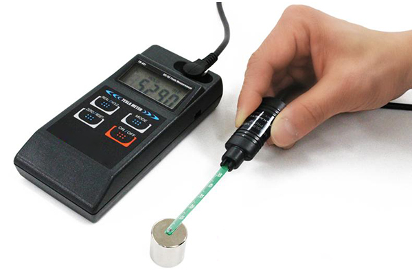 Testing a neodymium magnet’s strength with a handheld Gauss meter